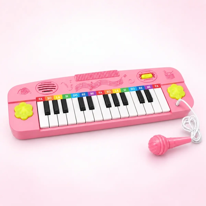 Różowy keyboard dziecięcy z mikrofonem pokazany pod kątem